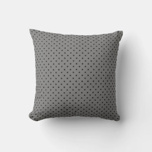 Petite étoile noire sur oreiller gris