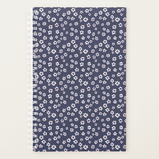 Petites fleurs blanches sur un planificateur bleu (Devant)
