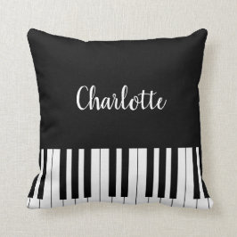 Pianotoetsenbord, zwarte en witte piloot kussen