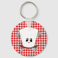 Picknicktafel met vrouwen kookmuts en BBQ-gereedsc
