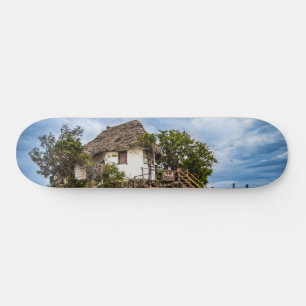 Pictureskast op een tropisch koraal skateboard
