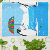 Pingouin dans la neige sur la serviette de cuisine (Plié)