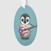 Pingouin de bébé jouant le bleu de guitare de (devant)
