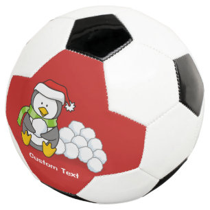 Pingouin de Noël assis avec des boules de neige