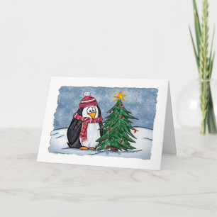 Pingouin en dessin mignon avec une carte de Noël e