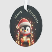 Pingouin mignon enveloppé dans les lumières de Noë (devant)