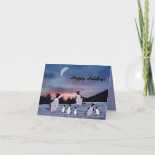 Pingouins sur le carte de fin de année de glace