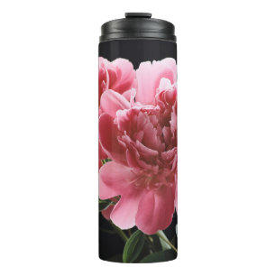 Pioen boeket close-up: roze rood thermosbeker