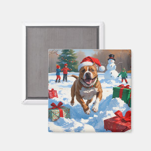 Pitbull-hond rent in de sneeuw met kerstmuts magneet