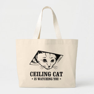 Plafondkat kijkt naar je grote tote bag