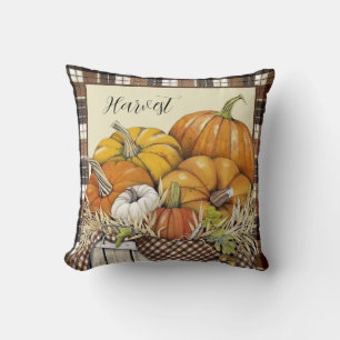plaid automnal et coussin jeté de citrouilles