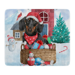 Planche À Découper Chien teckel dans la maison de Noël enneigée