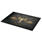 Planche À Découper Crâne d'oiseau doré sur fond noir (Coin)