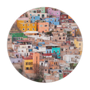 Planche À Découper Des maisons colorées sur la colline
