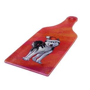 Planche À Découper Husky à Santa Hat Sur Rouge