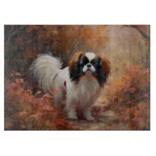 Planche À Découper Japanese Chin dans les feuilles d'automne tombent