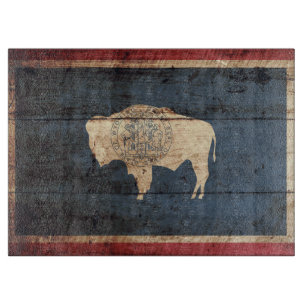 Planche À Découper Le drapeau de l'État du Wyoming sur le vieux grai