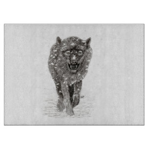 Planche À Découper Loup noir en colère dans la neige, hiver sauvage