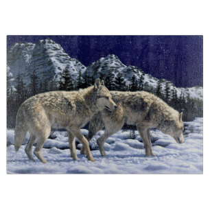 Planche À Découper Loups gris dans les montagnes d'hiver neigeuses