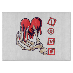 Planche À Découper Main de squelette symbolique de l'amour offrant un