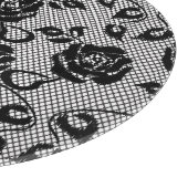 Planche À Découper motif en dentelle noire sur arrière - plan blanc (Coin)