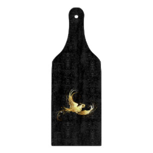 Planche À Découper Oiseau d'or sur Arrière - plan noir