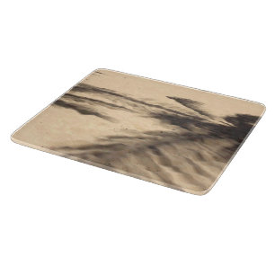Planche À Découper Ombres sur le sable