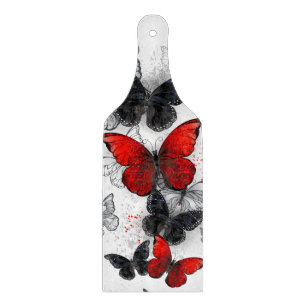 Planche À Découper Papillons noirs et rouges volants