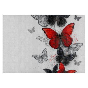 Planche À Découper Papillons noirs et rouges volants