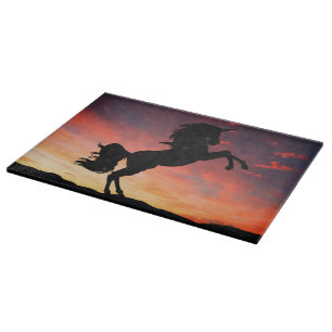 Planche À Découper Silhouette de licorne au coucher du soleil sur Gla