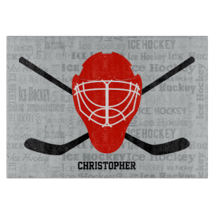 Planche À Découper Typographie rouge de casque et de bâtons de hocke