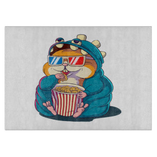 Planche À Découper Un hamster drôle portant des lunettes mange du pop