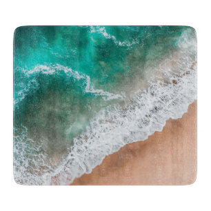 Planche À Découper Vagues sur la plage de sable