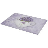 Planche À Découper Violettes Dans Une Théière (Coin)