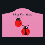Plaque De Porte Ladybugs Crest Sign<br><div class="desc">Sweet picture of two ladybugs on a pink background, is featured on this crest door sign. You can add baby's name to the door sign. Sign is ultra-durable, Grade-A acrylic, with adhesive backing. This design is also available on a baby bodysuit, bib, blanket and window cling to complete the gift...</div>