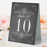Plaque De Table Collection de Mariages Ornate Chalkboard<br><div class="desc">La collection de mariages en damier orné est parfaite pour tout couple qui planifie un mariage romantique cette année. Ces numéros de table peuvent être personnalisés pour votre occasion spéciale et rendraient la pièce de table parfaite pour n'importe quel mariage, douche nuptiale, fête de fiançailles, fête d'anniversaire et bien plus...</div>