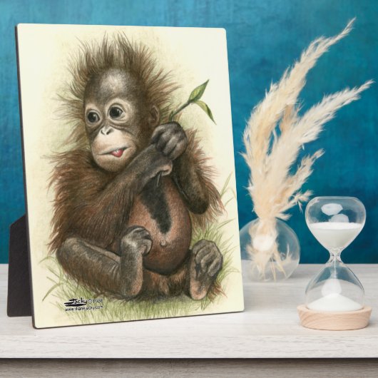Plaque Photo Bébé orang-outan avec des feuilles (Côté)