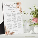 Plaque Photo Carte de siège Mariage floral en terre cuite<br><div class="desc">Créez un affichage unique et étonnant pour votre réception de mariage avec cette plaque de table en plumes de sauce et en organigramme. Cette plaque présente un beau design de fleurs bohèmes, de pampas brunes et d'éléments d'automne, ainsi que vos noms, dates de mariage et assignations de table. Il est...</div>