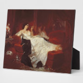 Plaque Photo Femme sur un canapé rouge (Côté)