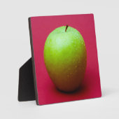 Plaque Photo Green apple on red background (Recto)