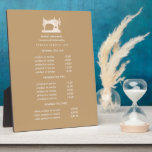 Plaque Photo Machine à coudre Or Seamstress Prix en beige<br><div class="desc">Le design sous-estimé affiche vos services, liste de prix ou informations commerciales sous une illustration d'une machine à coudre vintage en faux or sur un arrière - plan beige et votre nom ou nom d'entreprise. Comprend trois en-têtes personnalisables et des champs de texte corps. Pour ajuster la disposition, entrez votre...</div>