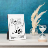 Plaque Photo Opticien qui fait un test oculaire. Drôle (Côté)