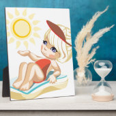 Plaque Photo Petite fille bronzer sur la plage (Côté)
