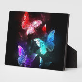 Plaque Photo Trois papillons brillants sur l'arrière - plan de  (Côté)