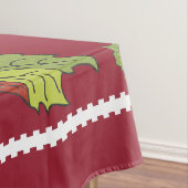 Poinsettias de monogramme sur la nappe rouge de (In Situ)