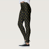 Point jaune sur leggings noirs (Gauche)