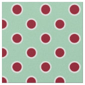 Pois rouge foncé décrit sur le tissu vert clair (Détail)