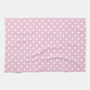 Pois sur la serviette de cuisine rose douce
