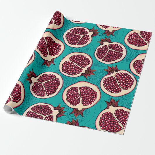 Pomegranaatplakken op turquoise cadeaupapier (Uitgerold)