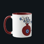 pomegranate with evil eye mug<br><div class="desc">Pomegranate in many cultures symbolizes abundance, blessing, fertility, and immortality. And the evil eye to ward of the negativity when you begin your day with a coffee in this unique mug.</div>